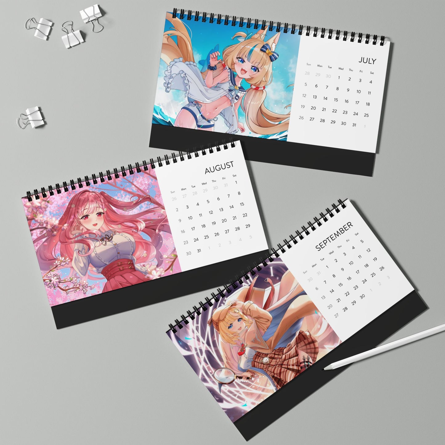 High-quality waifu VTuber wall and desktop calendars featuring 12 vibrant poster-style art prints inspired by Hololive, Sameko Saba, Nimi Nightmare, and Mint Fantome; perfect anime merch for VTuber fans and collectors lllustrated by Orihime Studio